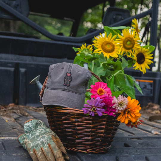 Washed brown pigment dye dad hat with embroidered camo bear patch on the front